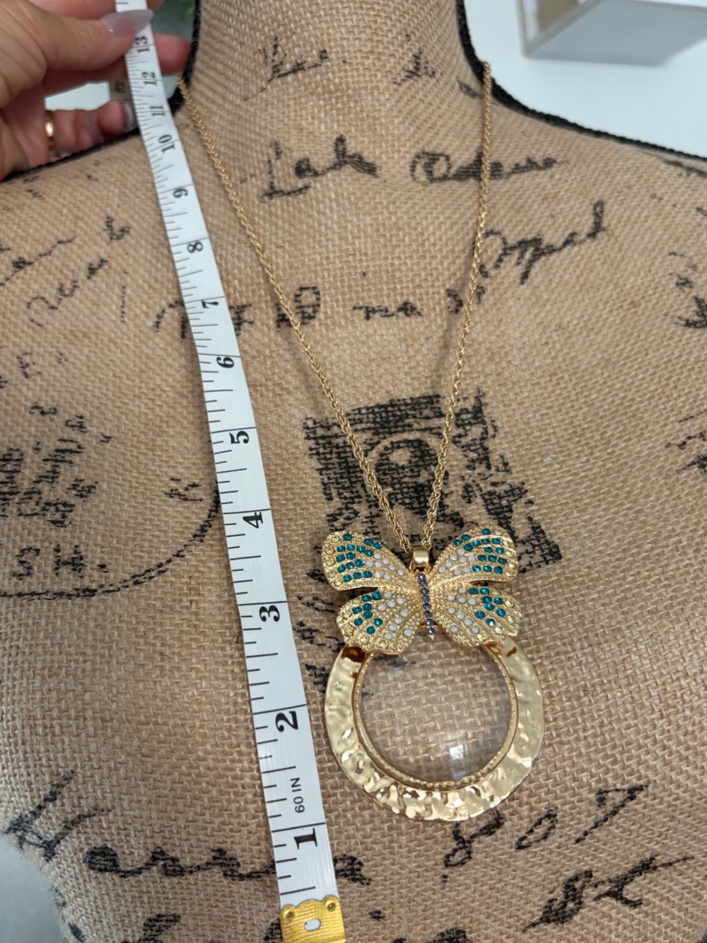 Gold Butterfly Magnifying Glass Necklace with Blue and Teal Accents